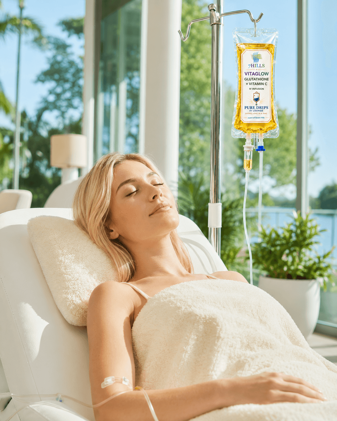 Person with radiant, glowing skin relaxing during an antioxidant IV drip in a sunlit lounge